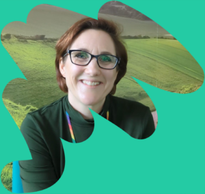 A Rethinking Our Health workshop space featuring flipcharts and whiteboards covered in colourful sticky notes. One flipchart is labelled "SOLUTIONS" with a hand-drawn lightbulb in the centre, surrounded by ideas on post-it notes. In the background, posters titled "YOUR HEALTH" and "BARRIERS" are visible, with more sticky notes and diagrams. The image is framed by an abstract teal shape.