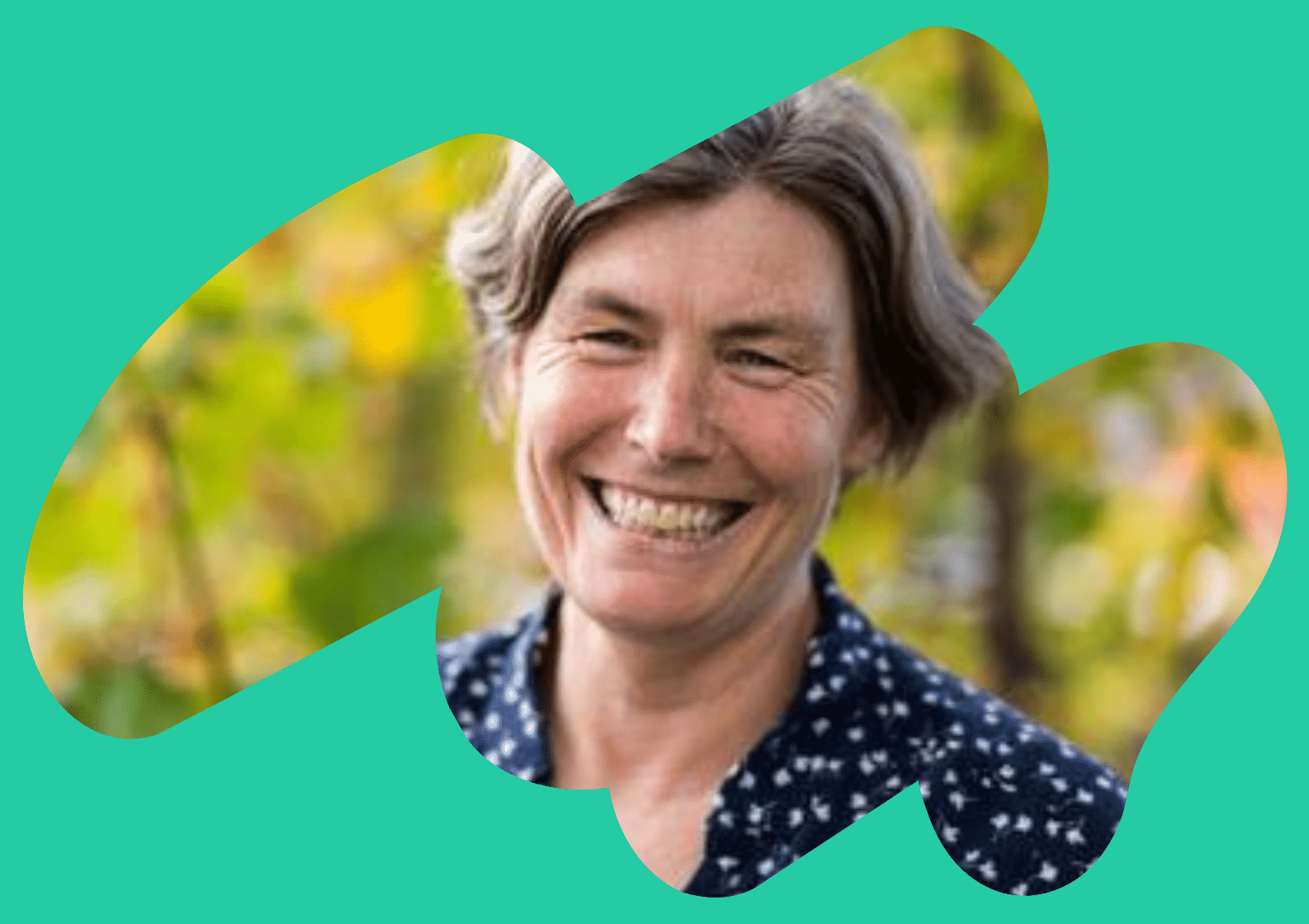 South Asian man sat talking to a care navigator in a medial consultation room
