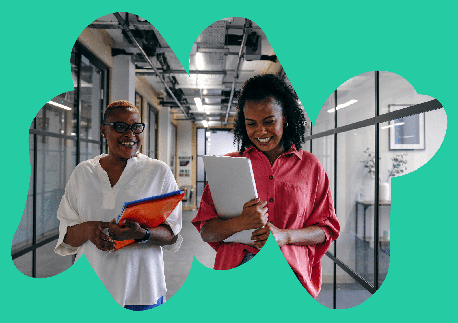 South Asian man sat talking to a care navigator in a medial consultation room